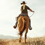Woman horseriding on desert, Utah, USA